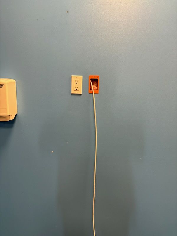 Wall outlet and conduit in a remodeled space