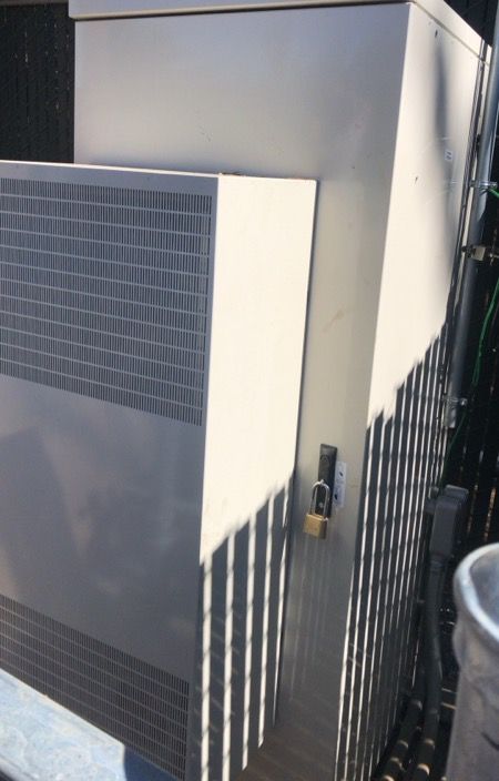 Switchgear enclosure at a fenced equipment site